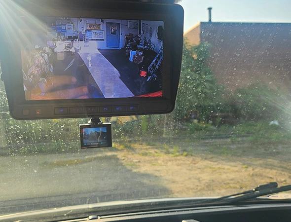 Dashboard-mounted car dash camera recording the road ahead