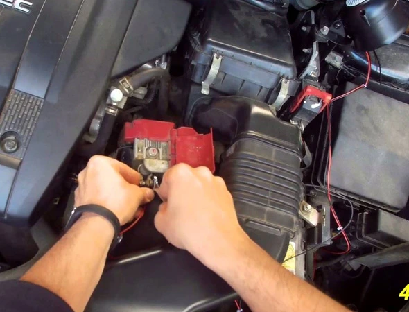 Technician installing keyless entry system in car in Stoneham MA